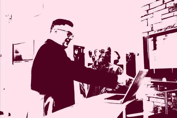 Dithered two men smiling a computer in an office
